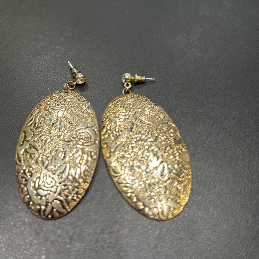 Large gold tone earring with CZ stone
